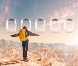 Girl with a bagpack in hills dreaming to fly 