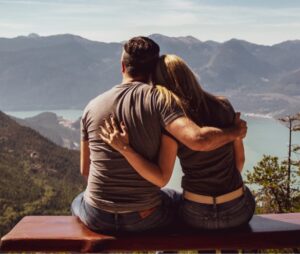 couple holding hand on mountain