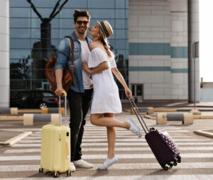 couple with bag near airport