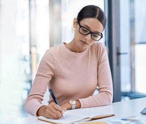  Girl writing down positive thoughts